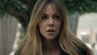 Kaitlin Olson's Morgan watching something intently while standing outside in High Potential