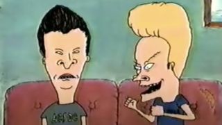 Beavis having a fake seizure on the coach next to Butt-Head in Beavis and Butt-Head